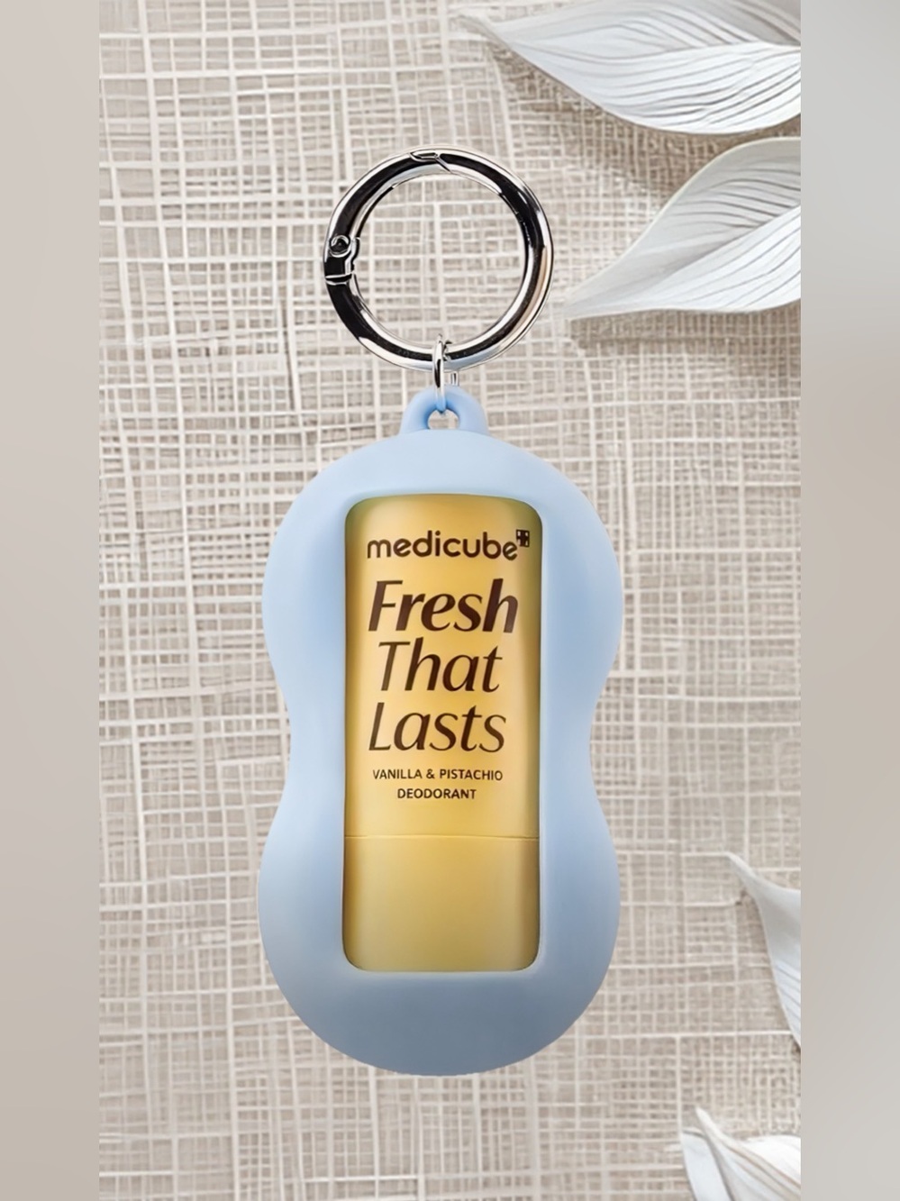 Medicube Fresh That Lasts Vanilla & Pistachio Mini Deodorant in a blue keychain